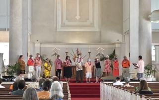 council members stand before the congregation to be installed during a Sunday morning service