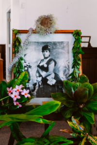 Framed photo of Queen Liliuokalani adorned in lei at Soldiers Chapel