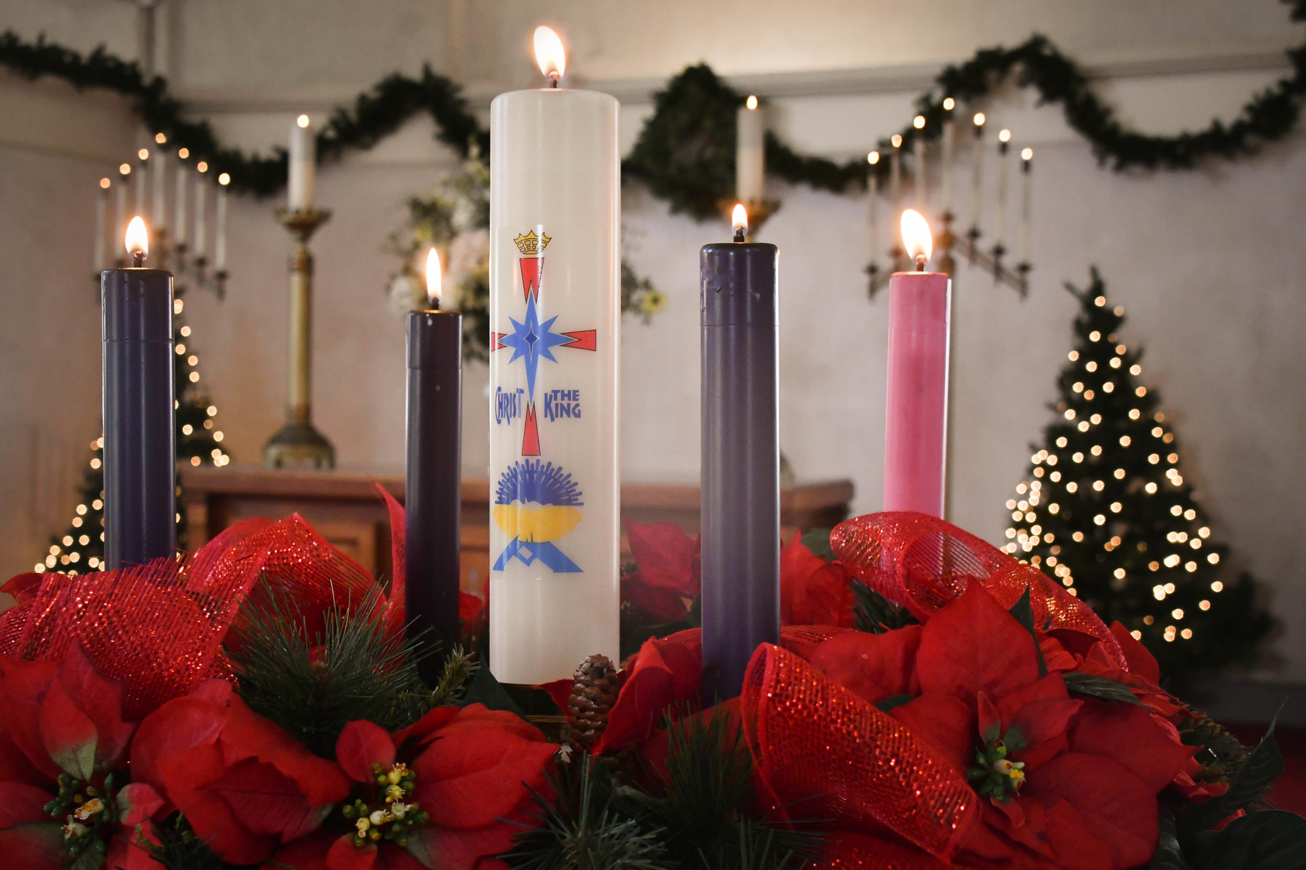five candles lit on advent wreath
