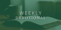 dark green background opaque photo of open bible and mug text reads weekly devotional