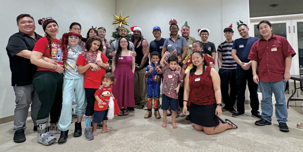 group of youngish adults and families at Christmas party